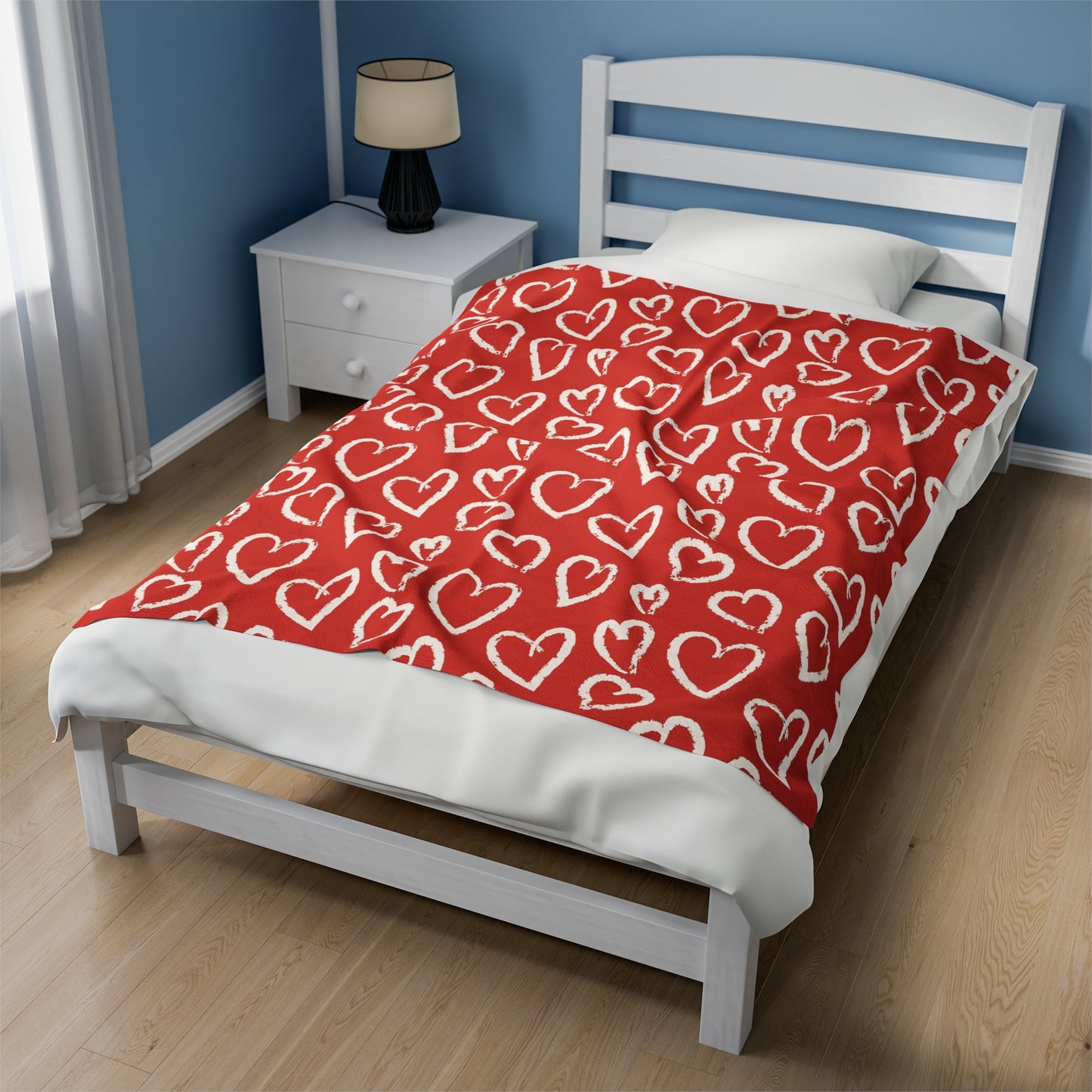 a bed sitting in a bedroom next to a window
