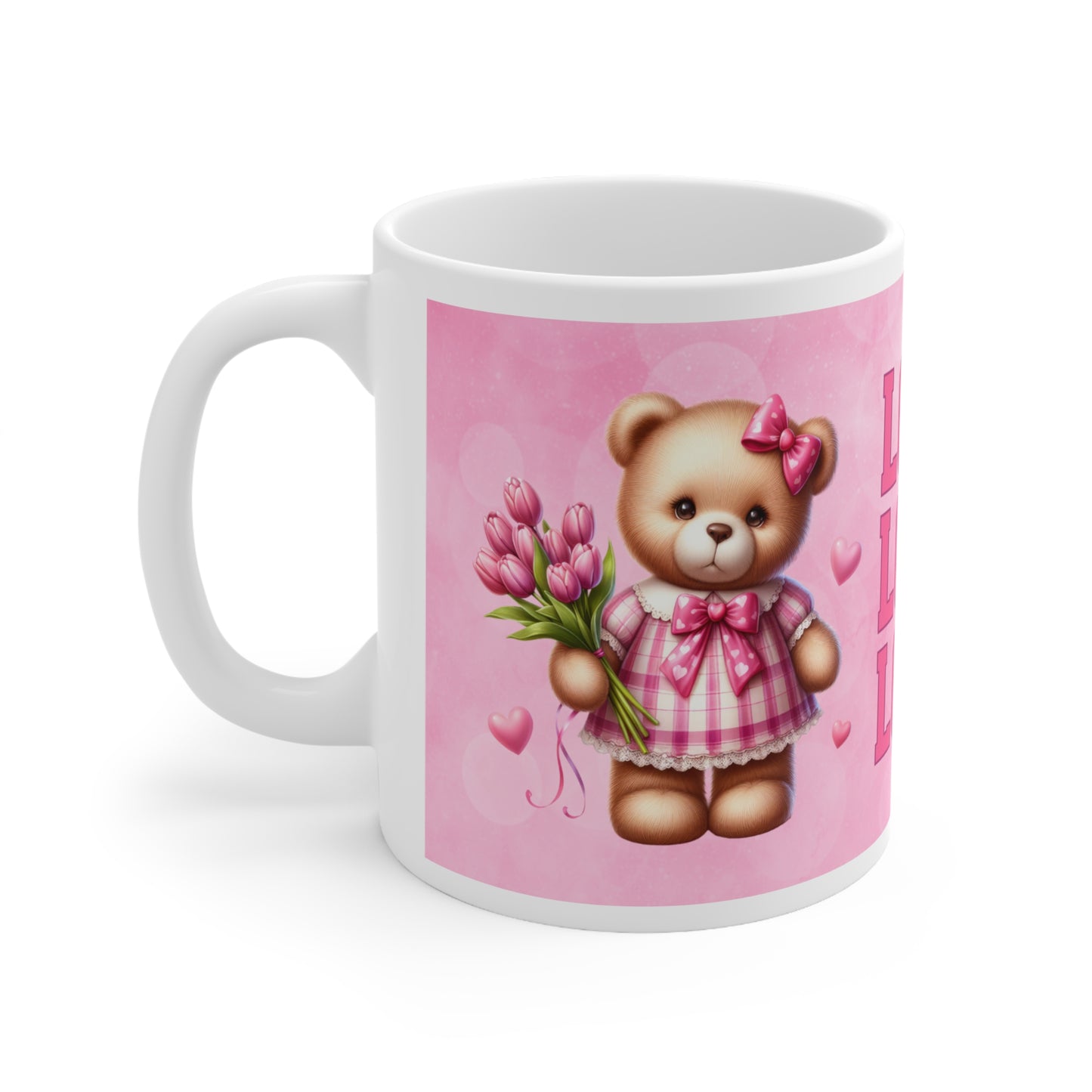 a pink and white teddy bear sitting next to a coffee cup 