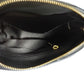 a black leather purse with a black shoe 