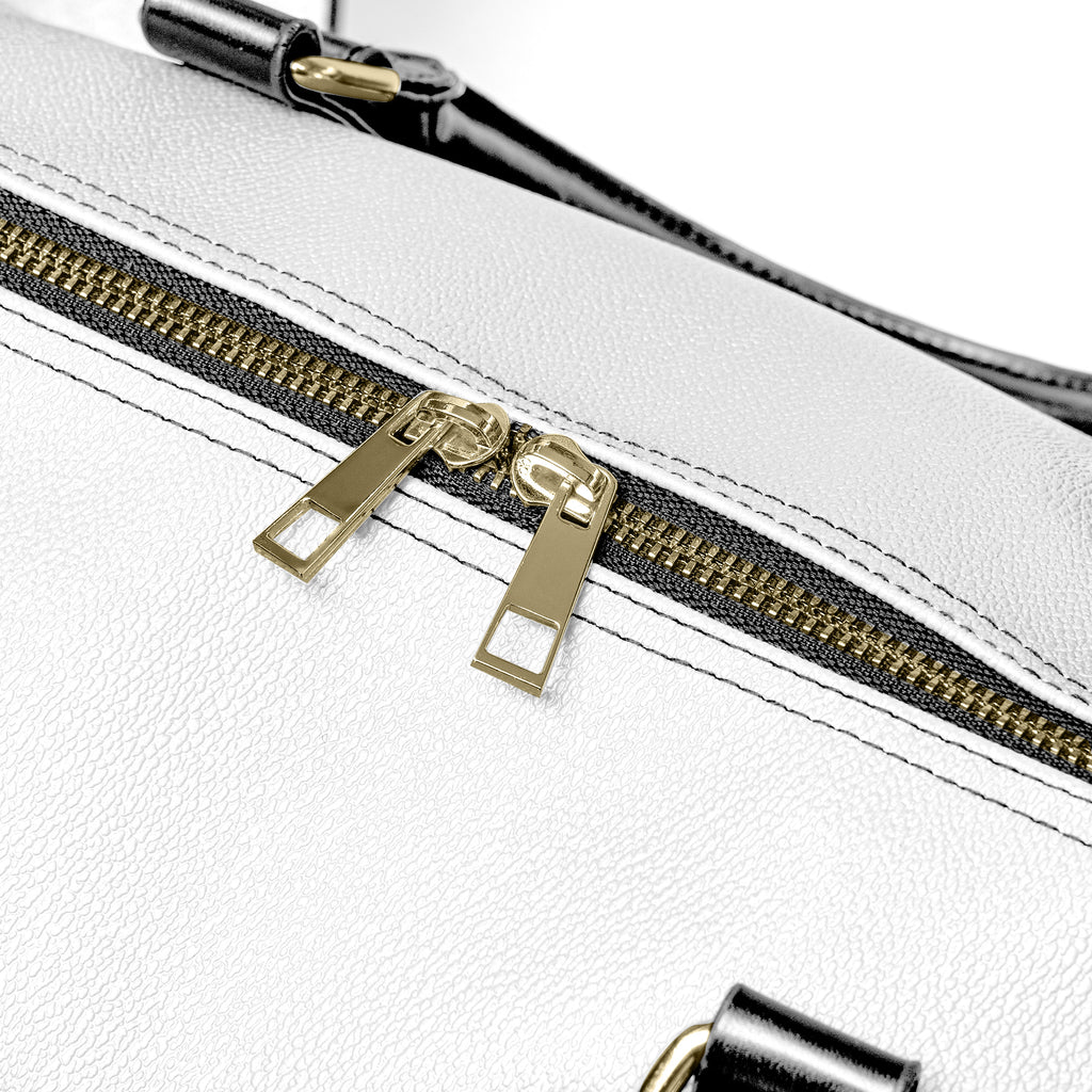 “Western-inspired women’s duffel bag displayed outdoors.”