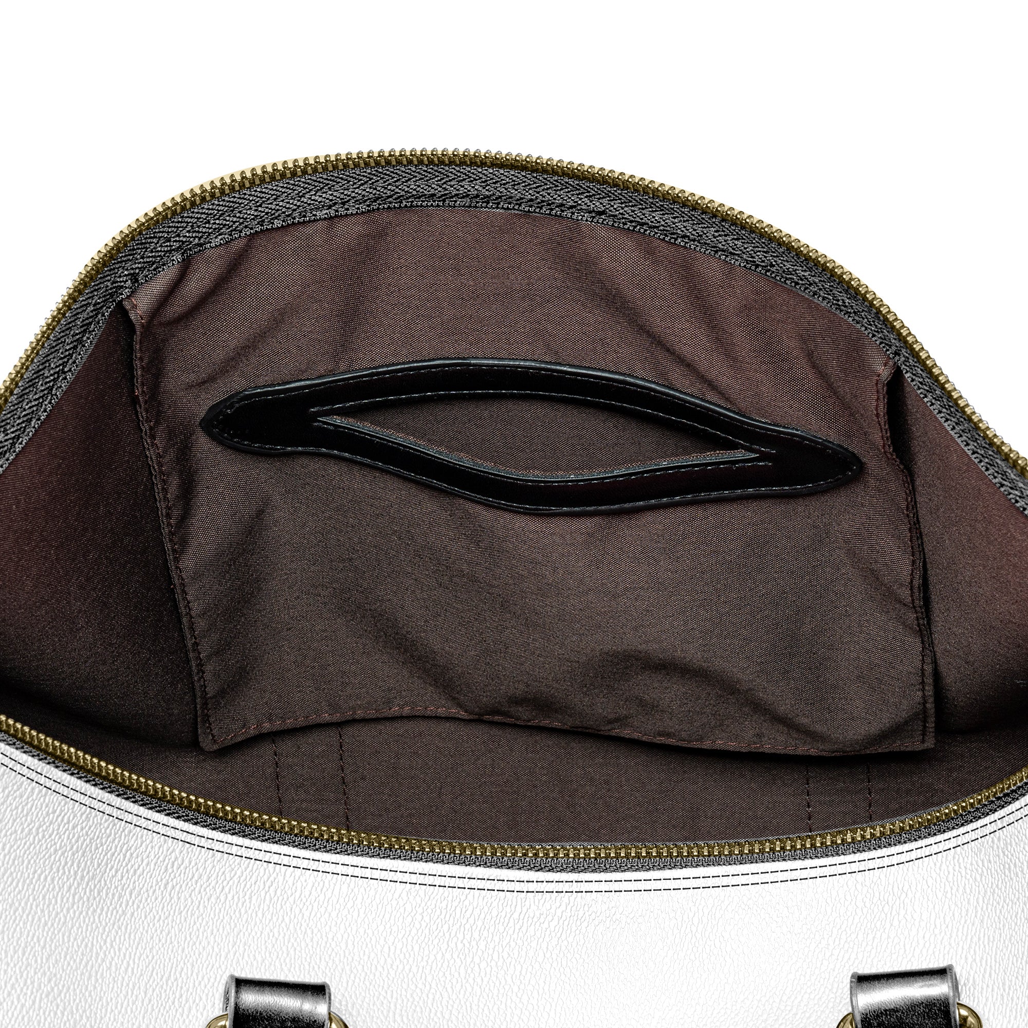 “Western-inspired women’s duffel bag displayed outdoors.”
